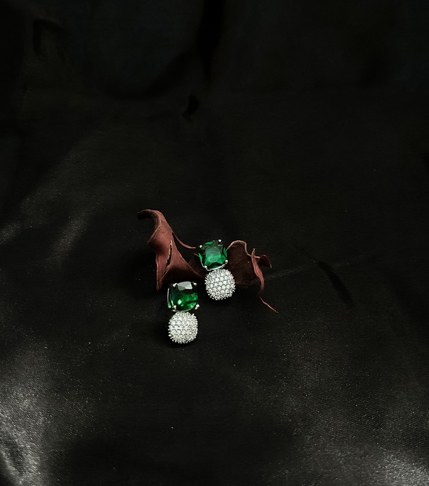 Emerald Enchantment: Statement Studs with Radiant Diamonds for a Touch of Luxury